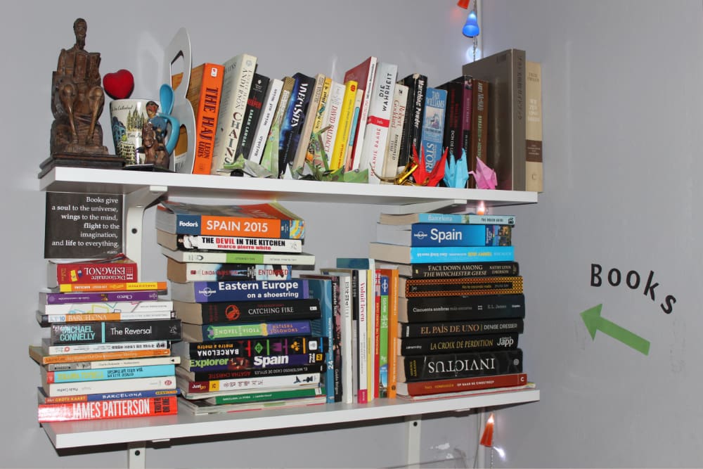 sleep green barcelona hostel book shelf